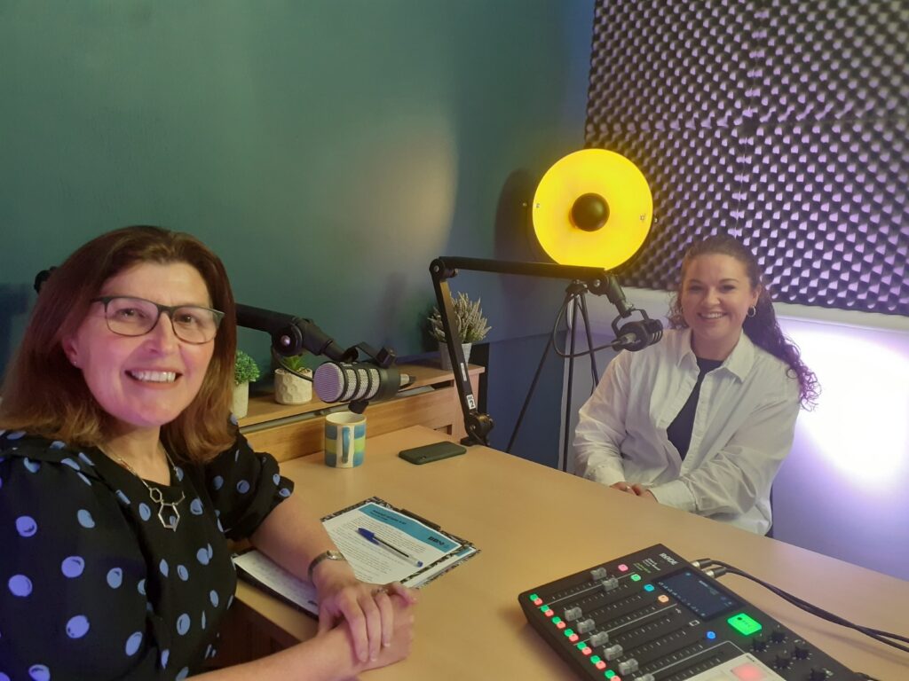 2 ladies sitting in the BBNI podcast studio, about to record a podcast